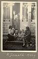 1944 - Riga's beach, Latvia.<br />Mother and aunt Erna in the doorway.<br />Arnis, Baiba, and Egils sitting between two women.