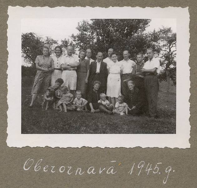 1945 - Oberornau, Bavaria, Germany.<br />Back: ?, ?, Dr. Dargevics (sp), ?, ?, Karlis, ?, Hilda, ?, ?, ?<br />Front: Erna?, Baiba, Egils, ?, Arnis, Elga, grandmother Alvine (sp).