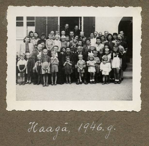 1946 - Haag, Bavaria, Germany.<br />Latvian community in an American displaced persons camp.<br />Back: Karlis on right. Middle: Hilda holding Baiba and next to Erna. Front middle: Egils, Elga, Arnis.