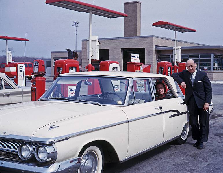 April 1963 - Somewhere on the NY State Throughway east of Buffalo.<br />Mather and father refueling their 1963 Mercury.<br />(On the way to take Frank and myself to the bus station in Buffalo to go to Chicago.)