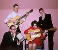 Feb 1964 - At Eriks' and Velta's in Jamaica Plain, Boston, MA.<br />Egils, Juris, Helga, and Uldis fooling around<br />(except for Juris, no one knows how to play an instrument)..