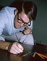 Aug 1964 - At parents' apartment in Ipswich, MA.<br />Uldis playing pick-up sticks.