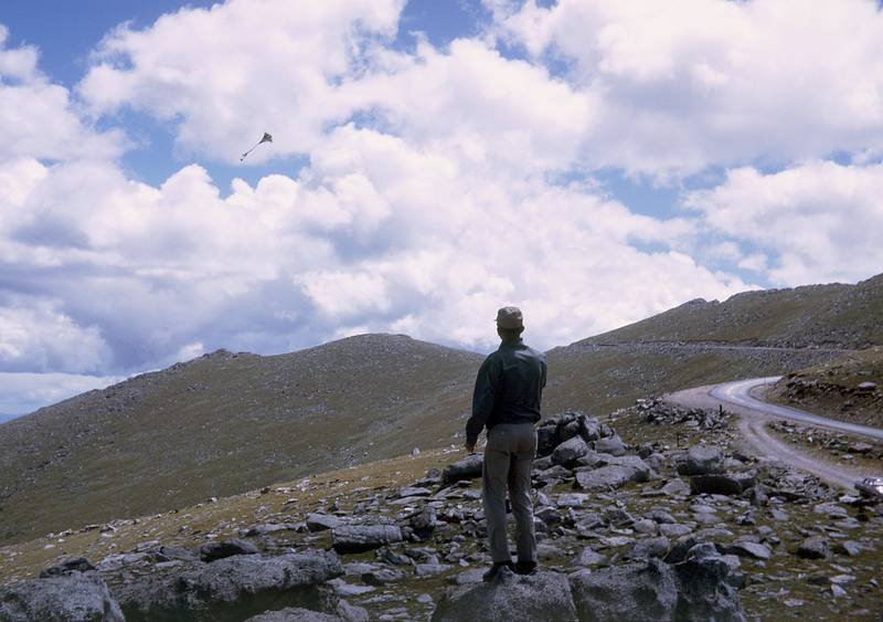 Aug 20, 1965 - Mt. Evans road, Colorado.<br />Frank flying a kite.
