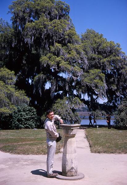 April 10, 1966 - Middleton Gardens, South Carolina.<br />Frank checking his watch against the sun dial.