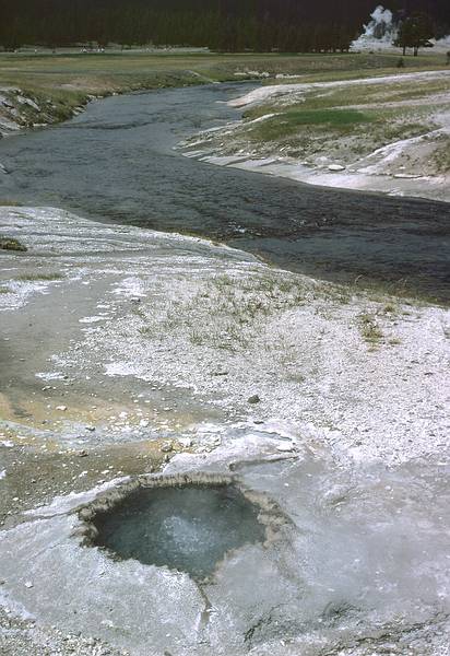 August 15, 1979 - Yellowstone National Park, Wyoming.<br />Hot pool and Firehole River in the background.