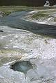 August 15, 1979 - Yellowstone National Park, Wyoming.<br />Hot pool and Firehole River in the background.