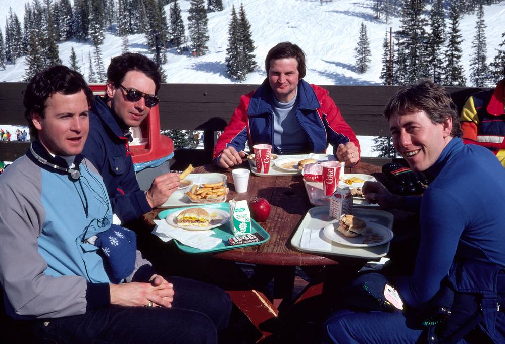 March 4, 1981 - Alta, Utah.<br />Dave, Oscar, Harry, and Jim having lunch on a terrace on the slopes.