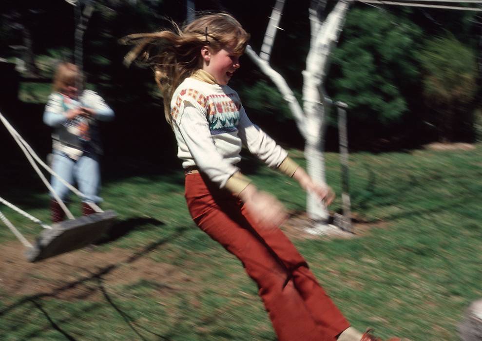 April 19, 1981 - Manchester by the Sea, Massachusetts.<br />Krista jumping off the swing.