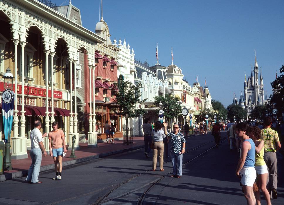 Oct. 7, 1981 - Disneyworld, Orlando, Florida.<br />Passing the time between work and flight back home.<br />Pete, Bryce, and John (waving) on the main street.