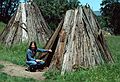 May 7, 1984 - Point Reyes National Seashore Visitor Center and Miwok Indian Village, California.<br />Joyce and teepee like structures in the Miwok village.