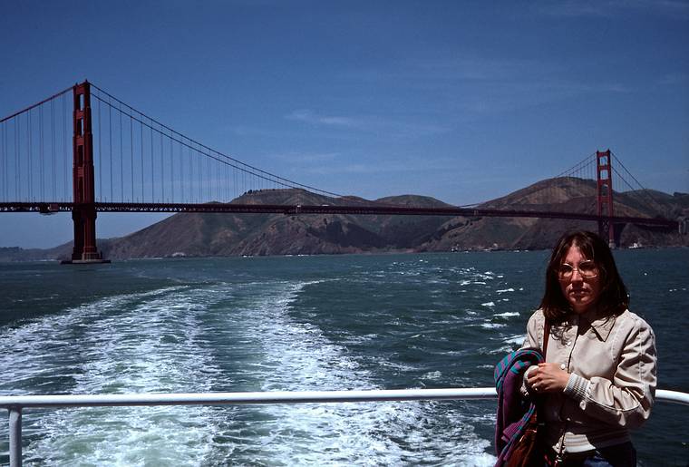 May 9, 1984 - San Francisco, California.<br />Sightseeing boat ride from Pier 39 to Golden Gate Bridge and back.<br />Joyce and Golden Gate Bridge.