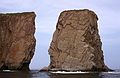August 4-18, 1985 - Off Perc, Gasp Peninsula, Quebec, Canada.<br />A forillon, a piece of rock that has separated from the mainland.<br />The arch above the opening collapsed sometime at the beginning of the 1900s.