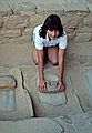 July 26, 1986 - Mesa Verde National Park, Colorado.<br />Spruce Tree House Anasazi village.<br />Melody using a metate and a mano.