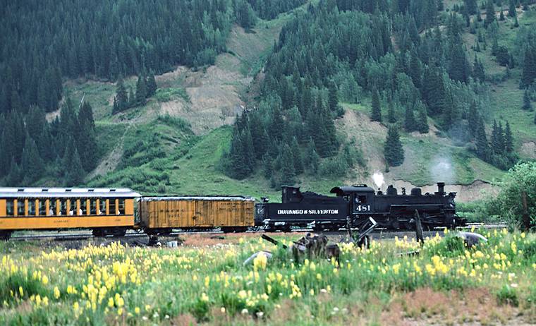August 1, 1986 - Between Durango and Ouray, Colorado.<br />The Silverton-Durange steam train leaving Silverton for Durango.