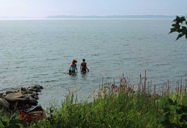 August 16-30, 1987 - Camping on Burton Island on Lake Champlain, Vermont.<br />Melody, Becky, and Eric going swimming off our camp site.