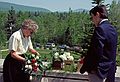 May 29, 1988 - Latvian Memorial Park, Catskills, New York.<br />Baiba arranging flowers for mother's and father's urns while Julian watches.