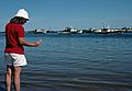 July 15, 1988 - Somewhere along the Maine coast on our way back from Bailey Island.<br />Joyce looking at a starfish.