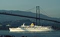 August 26, 1988 - Vancouver, British Columbia, Canada.<br />Stanley Park.<br />The perviously docked liner, Daphne, now heading for the open seas under Lions Gate Bridge.