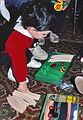 Dec. 25, 1989 - At Memere Marie's in Lawrence, Massachusetts.<br />TJ playing with his new Brio train set.