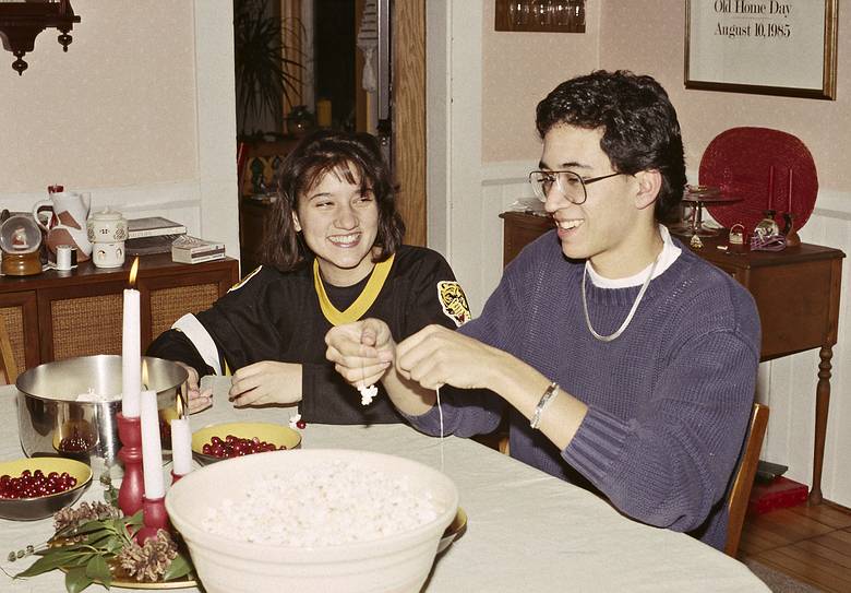 December 22, 1990 - Merrimac, Massachusetts.<br />Cranberry and popcorn or decorate the Christmas tree time.<br />Melody and Eric threding the cranberries and popcorn.