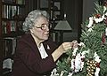 December 22, 1990 - Merrimac, Massachusetts.<br />Cranberry and popcorn or decorate the Christmas tree time.<br />Marie helping decorate the tree.