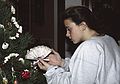 December 22, 1990 - Merrimac, Massachusetts.<br />Cranberry and popcorn or decorate the Christmas tree time.<br />Belen admiring a Spanish decoration (a fan or abanico).