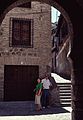 June 30, 1990 - Toledo, Spain.<br />Joyce and Ronnie, narrow alley, seen through Moorish arch.