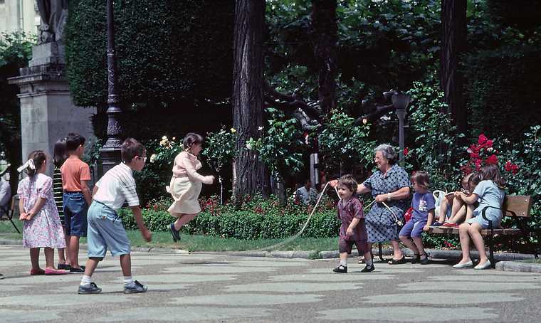 July 2, 1990 - Burgos, Spain.<br />A grandmother entertaining some children.