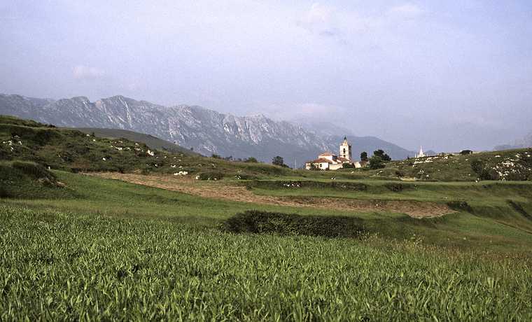 July 3, 1990 - Cue, Asturias, Spain.<br />Local church with the Picos the Europa in the background.