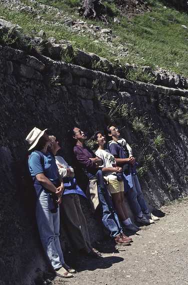 July 6, 1990 - Hike in the Garganta del Cares (Cares River Gorge), Leon, Spain.<br />Joyce, Baiba, Ronnie, Melody, and Julian leaning against a stone wall<br />below the water canal and looking at something across the gorge.