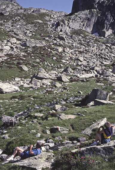 July 13, 1990 - Hike into lakes region south of Salardu, Lerida, Spain.<br />Ronnie and Baiba relax while Joyce and Melody climb to a snowfield somewhere in this photo.