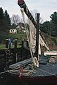 October 1991 - York, Maine.<br />Joyce looking at a gundalow with a lateen sail.