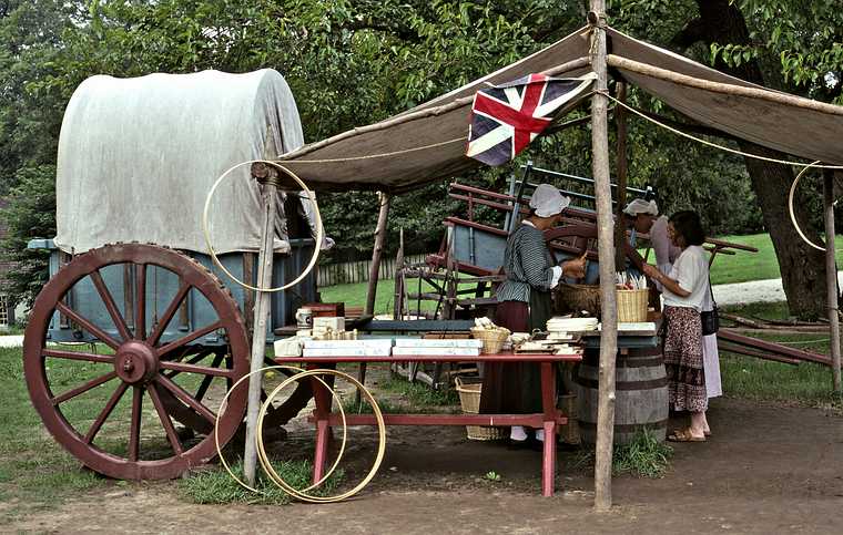 August 20, 1992 - Colonial Williamsburg, Virginia.<br />Joyce buying something from a local vendor.