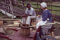 August 20, 1992 - Colonial Williamsburg, Virginia.<br />Basket weaver and a customer.