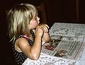 August 25, 1993 - Collin House B&B, Fayetteville, New York.<br />The owners' daughter reading the paper.