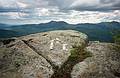 May 27, 1995 - South Moat Mountain, Albany, New Hampshire.<br />The finished work: sand dollar arrow on a rock atop S. Moat and pointing to Mt. Chicoroa.