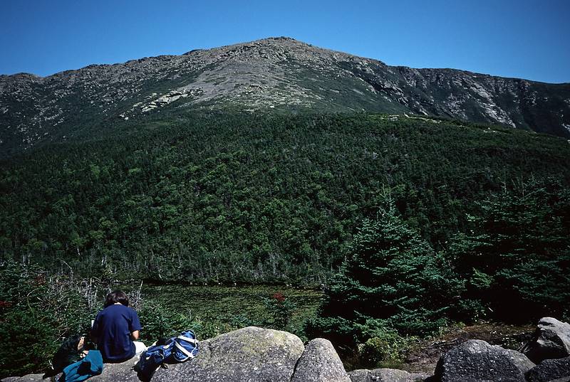 August 26, 1995 - Franconia Notch/Mount Lafayette, New Hampshire.<br />Joyce sketching at the Greenleaf AMC hut with Mount Lafayette in back.