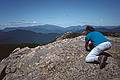 Sept. 2, 1995 - Mount Chocorua, New Hampshire.<br />Joyce drawing a lady with string and necklace atop Mt. Chocorua.