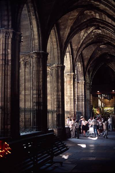 July 15, 1995 - Barri Gotic (Gothic neighborhood), Barcelona, Spain.<br />Massive columns along walkway around the courtyard of the cathedral.<br />Joyce.