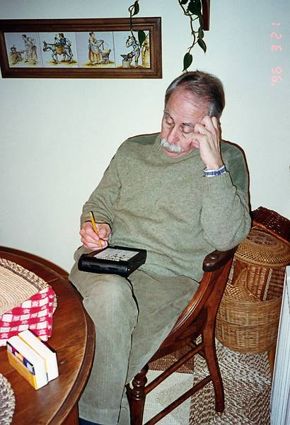 March 21, 1996 - At Baiba and Ronnie's in Baltimore, Maryland.<br />Ronnie doing a crossword puzzle at the kitchen table.