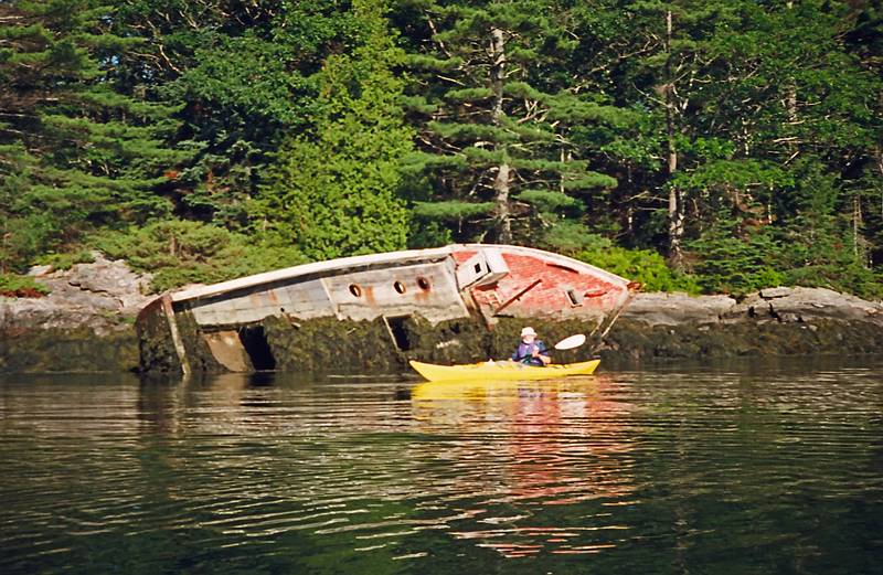 July 7, 1996 - Kayaking in Maine.<br />Egils in front of a wrecked fishing boat in cove on S. tip of Westport Island<br />(off Gooserock passage to Sheepscot River).