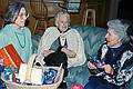 Jan. 18, 1997 - At Tom and Kim's for Marie's 75th birthday, South Hampton, New Hampshire.<br />Joyce, Joanne, and Marie, who is opening on of her 75 presents,<br />one for each year.