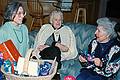 Jan. 18, 1997 - At Tom and Kim's for Marie's 75th birthday, South Hampton, New Hampshire.<br />Joyce, Joanne, and Marie, who is opening on of her 75 presents,<br />one for each year.