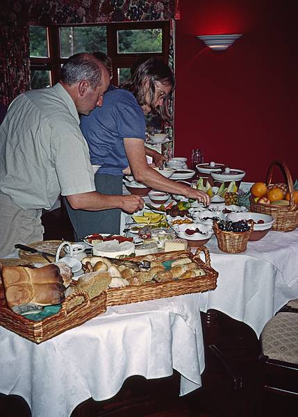 Terry and Leann helping themselves to some breakfast food.<br />Hanora's Cottage.<br />Sept. 4, 1999 (Day 7) - Ballymacarbry, County Waterford, Ireland.