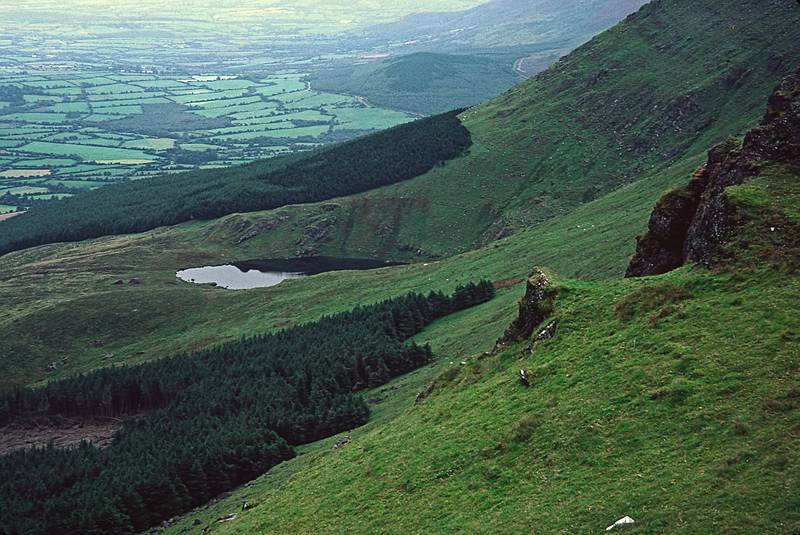 Tarn and view of the other side of the ridge.<br />Hike to peat bog and on to ridge.<br />Sept. 4, 1999 (Day 7) - Nire Valley, County Waterford, Ireland.