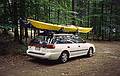 Joyce's blue kayak and my yellow kayak atop our car.<br />August 20, 2000 - Camping trip to White Lake State Park, West Ossipee, New Hampshire.