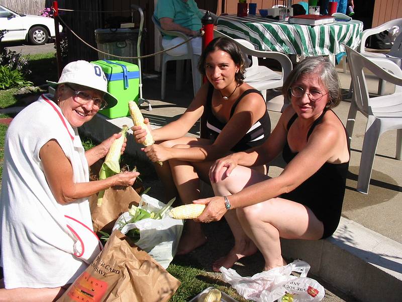 Aug 26, 2001 - At Marie's, Lawrence, Massachusetts.<br />Marie, Melody, and Joyce shucking corn.