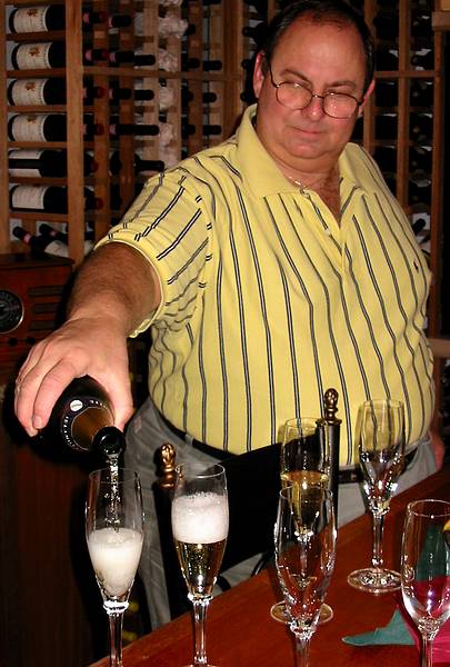 Dec 15, 2001 - At Dominic and Marian's, North Andover, Massachusetts.<br />Dominic pouring some champagne.