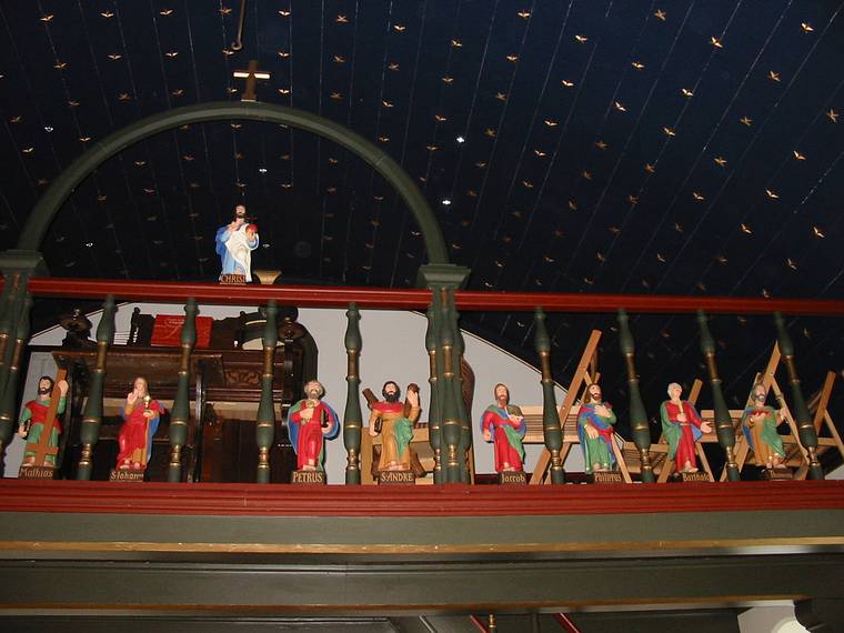 Aug 28, 2001 - Church at ingeyrar, Iceland.<br />Wooden figures in the balcony railing.