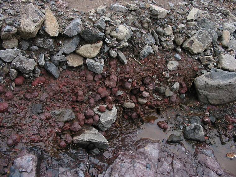 Sept 1, 2001 - Eskifjrur, Iceland.<br />The round rocks at the edge of the mudslide.